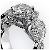 Platinum filigree & milgrain ring with 1.75ct center diamond, .30ct pear shaped side diamonds, and 152 small diamonds set in shank.